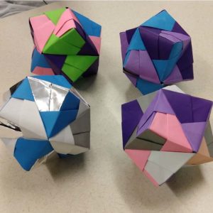 Multi-sided colorful cubes represent GirlsGetMath@CSU summer program