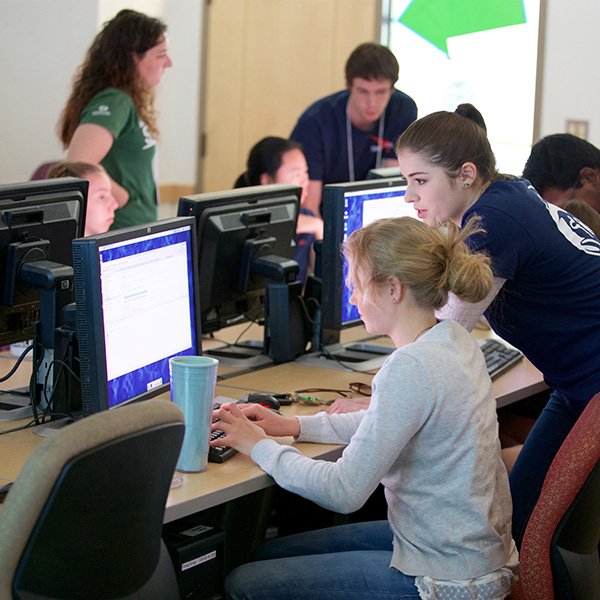 STEM students and instructors actively engaged at computers